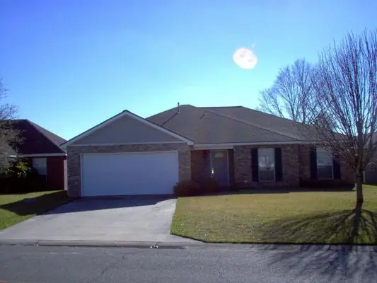 Finished brick ranch home with two car garage built by Sade Construction